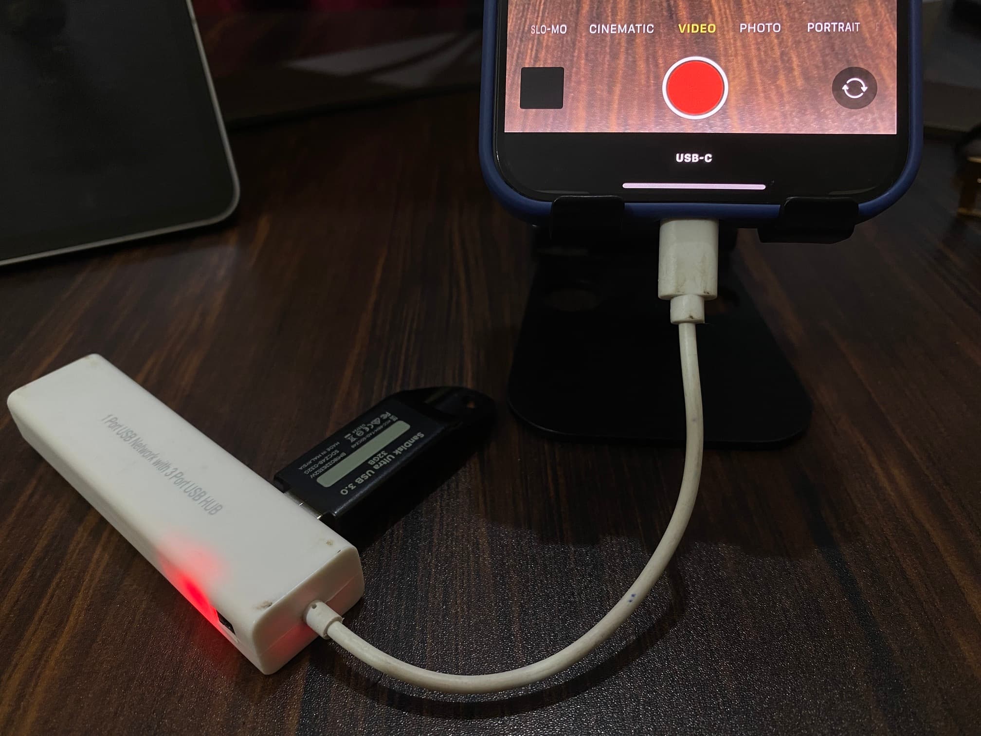 USB pen drive connected to iPhone via USB-C dongle