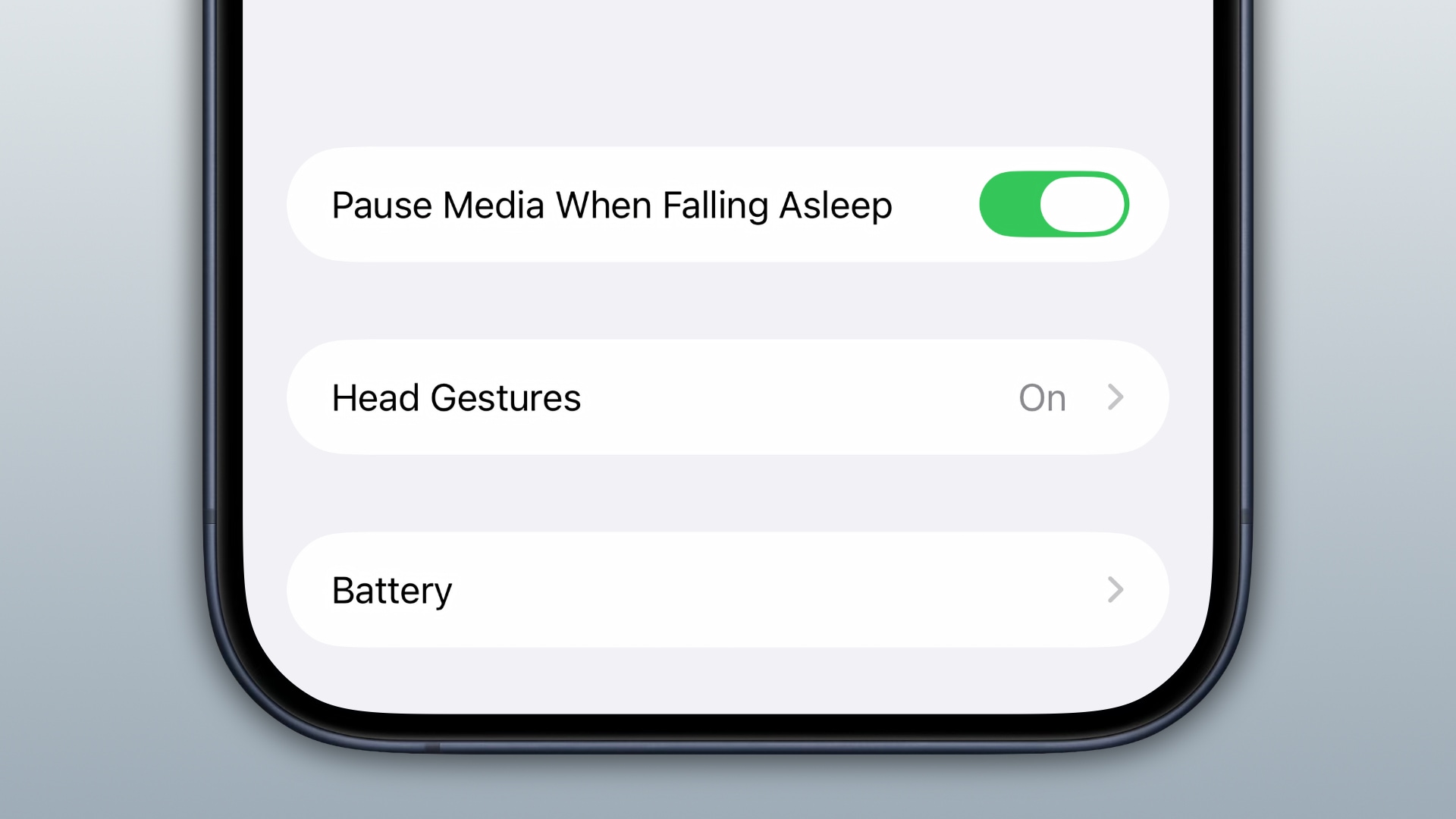 AirPods settings on iPhone with the option to automatically pause media playback when falling asleep turned on.