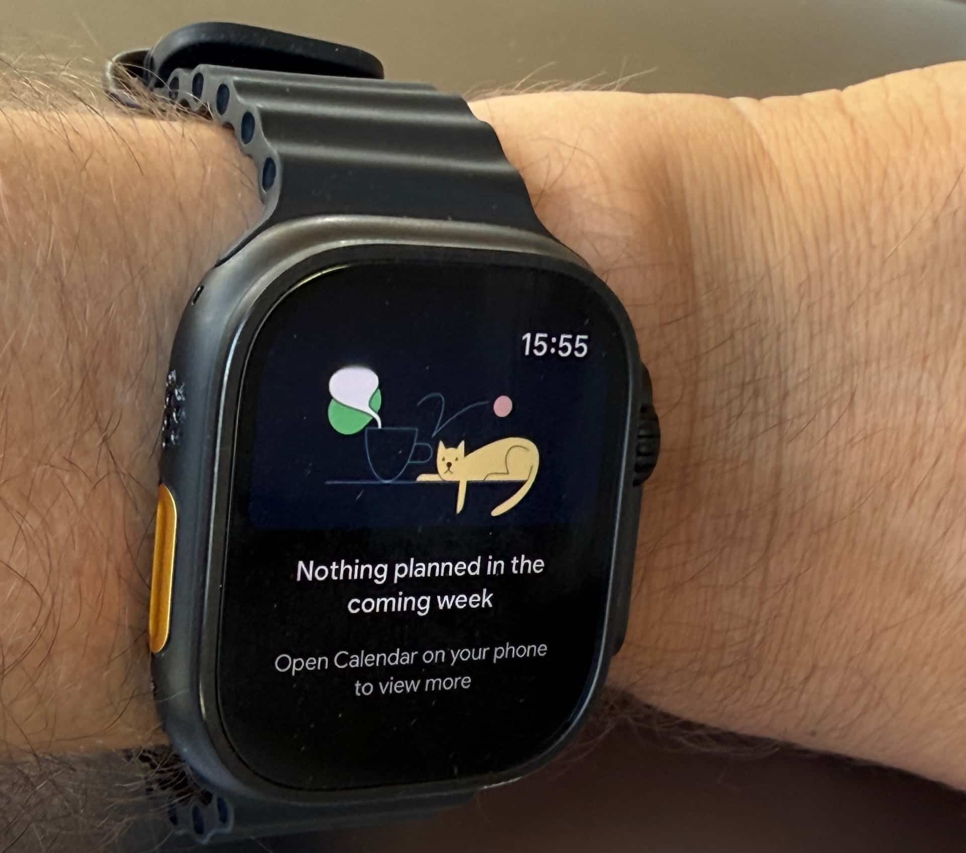 Google Calendar running on an Apple Watch on a male wrist, displaying a message that there are no upcoming events.